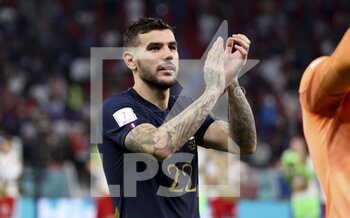 2022-12-04 - Theo Hernandez of France celebrates the victory following the FIFA World Cup 2022, Round of 16 football match between France and Poland on December 4, 2022 at Al Thumama Stadium in Doha, Qatar - FOOTBALL - WORLD CUP 2022 - 1/8 - FRANCE V POLAND - FIFA WORLD CUP - SOCCER