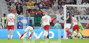 2022-12-04 - Olivier Giroud of France scores a goal 1-0 during the FIFA World Cup 2022, Round of 16 football match between France and Poland on December 4, 2022 at Al Thumama Stadium in Doha, Qatar - FOOTBALL - WORLD CUP 2022 - 1/8 - FRANCE V POLAND - FIFA WORLD CUP - SOCCER