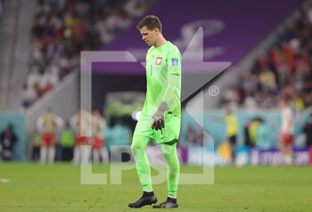 2022-12-04 - Goalkeeper Wojciech Szczesny of Poland looks dejected during the FIFA World Cup 2022, Round of 16 football match between France and Poland on December 4, 2022 at Al Thumama Stadium in Doha, Qatar - FOOTBALL - WORLD CUP 2022 - 1/8 - FRANCE V POLAND - FIFA WORLD CUP - SOCCER