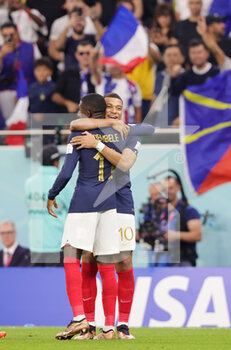 2022-12-04 - Kylian Mbappe of France celebrates his goal 2-0 with Ousmane Dembele during the FIFA World Cup 2022, Round of 16 football match between France and Poland on December 4, 2022 at Al Thumama Stadium in Doha, Qatar - FOOTBALL - WORLD CUP 2022 - 1/8 - FRANCE V POLAND - FIFA WORLD CUP - SOCCER