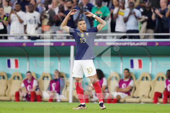 2022-12-04 - Kylian Mbappe of France celebrates his goal 2-0 during the FIFA World Cup 2022, Round of 16 football match between France and Poland on December 4, 2022 at Al Thumama Stadium in Doha, Qatar - FOOTBALL - WORLD CUP 2022 - 1/8 - FRANCE V POLAND - FIFA WORLD CUP - SOCCER