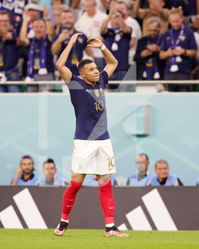 2022-12-04 - Kylian Mbappe of France celebrates his goal 3-0 during the FIFA World Cup 2022, Round of 16 football match between France and Poland on December 4, 2022 at Al Thumama Stadium in Doha, Qatar - FOOTBALL - WORLD CUP 2022 - 1/8 - FRANCE V POLAND - FIFA WORLD CUP - SOCCER