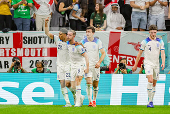 2022-12-04 - Jordan Henderson (8) of England scores a goal and celebrates 1-0 with Jude Bellingham during the FIFA World Cup 2022, Round of 16 football match between England and Senegal on December 4, 2022 at Al Bayt Stadium in Al Khor, Qatar - FOOTBALL - WORLD CUP 2022 - 1/8 - ENGLAND V SENEGAL - FIFA WORLD CUP - SOCCER