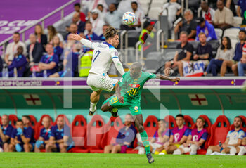 2022-12-04 - Jack Grealish (7) of England and Boulaye Dia (21) of Senegal during the FIFA World Cup 2022, Round of 16 football match between England and Senegal on December 4, 2022 at Al Bayt Stadium in Al Khor, Qatar - FOOTBALL - WORLD CUP 2022 - 1/8 - ENGLAND V SENEGAL - FIFA WORLD CUP - SOCCER