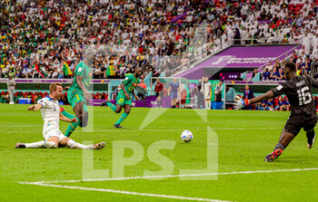 2022-12-04 - Harry Kane (9) of England, Kalidou Koulibaly, Edouard Mendy of Senegal during the FIFA World Cup 2022, Round of 16 football match between England and Senegal on December 4, 2022 at Al Bayt Stadium in Al Khor, Qatar - FOOTBALL - WORLD CUP 2022 - 1/8 - ENGLAND V SENEGAL - FIFA WORLD CUP - SOCCER