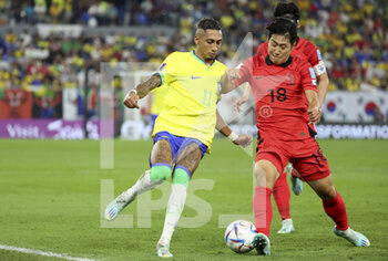 2022-12-05 - Raphinha of Brazil, Lee Kang-In of South Korea (left) during the FIFA World Cup 2022, Round of 16 football match between Brazil and Korea Republic on December 5, 2022 at Stadium 974 in Doha, Qatar - FOOTBALL - WORLD CUP 2022 - 1/8 - BRAZIL V KOREA REPUBLIC - FIFA WORLD CUP - SOCCER