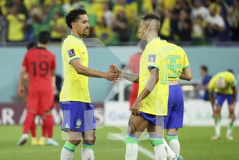 2022-12-05 - Marquinhos, Raphinha of Brazil celebrate the victory following the FIFA World Cup 2022, Round of 16 football match between Brazil and Korea Republic on December 5, 2022 at Stadium 974 in Doha, Qatar - FOOTBALL - WORLD CUP 2022 - 1/8 - BRAZIL V KOREA REPUBLIC - FIFA WORLD CUP - SOCCER