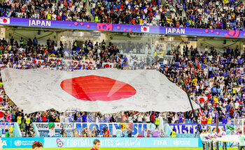 2022-12-06 - Japan flag floats across the fans during the FIFA World Cup 2022, Round of 16 football match between Japan and Croatia on December 5, 2022 at Al-Janoub Stadium in Al-Wakrah, Qatar - FOOTBALL - WORLD CUP 2022 - 1/8 - JAPAN V CROATIA - FIFA WORLD CUP - SOCCER