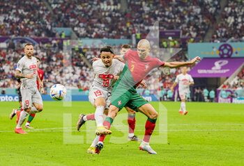 2022-12-06 - Noah Okafor (19) of Switzerland battles with Pepe (3) of Portugal during the FIFA World Cup 2022, Round of 16 football match between Portugal and Switzerland on December 6, 2022 at Lusail Stadium in Al Daayen, Qatar - FOOTBALL - WORLD CUP 2022 - 1/8 - PORTUGAL V SWITZERLAND - FIFA WORLD CUP - SOCCER