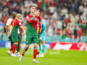 2022-12-06 - Cristiano Ronaldo (7) of Portugal thanks fans at full time during the FIFA World Cup 2022, Round of 16 football match between Portugal and Switzerland on December 6, 2022 at Lusail Stadium in Al Daayen, Qatar - FOOTBALL - WORLD CUP 2022 - 1/8 - PORTUGAL V SWITZERLAND - FIFA WORLD CUP - SOCCER