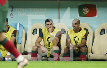 2022-12-06 - Cristiano Ronaldo, Joao Mario of Portugal on the bench during the FIFA World Cup 2022, Round of 16 football match between Portugal and Switzerland on December 6, 2022 at Lusail Stadium in Al Daayen, Qatar - FOOTBALL - WORLD CUP 2022 - 1/8 - PORTUGAL V SWITZERLAND - FIFA WORLD CUP - SOCCER