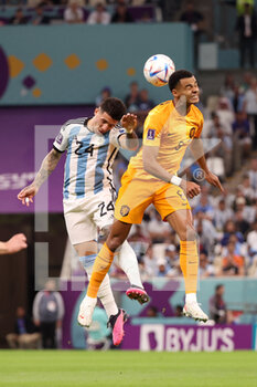 2022-12-09 - Enzo Fernandez of Argentina, Cody Gakpo of Netherlands during the FIFA World Cup 2022, Quarter-final football match between Netherlands and Argentina on December 9, 2022 at Lusail Stadium in Al Daayen, Qatar - FOOTBALL - WORLD CUP 2022 - 1/4 - NETHERLANDS V ARGENTINA - FIFA WORLD CUP - SOCCER