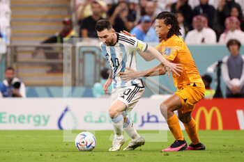2022-12-09 - Lionel Messi of Argentina, Nathan Ake of Netherlands during the FIFA World Cup 2022, Quarter-final football match between Netherlands and Argentina on December 9, 2022 at Lusail Stadium in Al Daayen, Qatar - FOOTBALL - WORLD CUP 2022 - 1/4 - NETHERLANDS V ARGENTINA - FIFA WORLD CUP - SOCCER