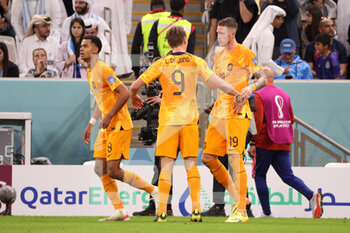 2022-12-09 - Wout Weghorst of Netherlands celebrates with team mates after scoring a goal to make it 2-2 during the FIFA World Cup 2022, Quarter-final football match between Netherlands and Argentina on December 9, 2022 at Lusail Stadium in Al Daayen, Qatar - FOOTBALL - WORLD CUP 2022 - 1/4 - NETHERLANDS V ARGENTINA - FIFA WORLD CUP - SOCCER
