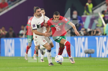 2022-12-10 - Ruben Neves of Portugal, Selim Amallah of Morocco during the FIFA World Cup 2022, Quarter-final football match between Morocco and Portugal on December 10, 2022 at Al Thumama Stadium in Doha, Qatar - FOOTBALL - WORLD CUP 2022 - 1/4 - MOROCCO V PORTUGAL - FIFA WORLD CUP - SOCCER