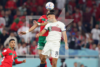 2022-12-10 - Jawad El-Yamiq of Morocco and Goncalo Ramos of Portugal during the FIFA World Cup 2022, Quarter-final football match between Morocco and Portugal on December 10, 2022 at Al Thumama Stadium in Doha, Qatar - FOOTBALL - WORLD CUP 2022 - 1/4 - MOROCCO V PORTUGAL - FIFA WORLD CUP - SOCCER