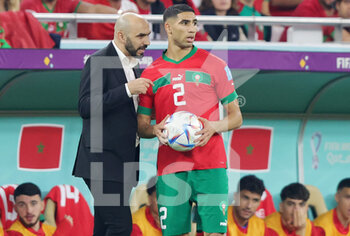 2022-12-10 - Head coach Walid Regragui of Morocco and Achraf Hakimi during the FIFA World Cup 2022, Quarter-final football match between Morocco and Portugal on December 10, 2022 at Al Thumama Stadium in Doha, Qatar - FOOTBALL - WORLD CUP 2022 - 1/4 - MOROCCO V PORTUGAL - FIFA WORLD CUP - SOCCER