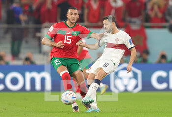 2022-12-10 - Bernardo Silva of Portugal, Selim Amallah of Morocco during the FIFA World Cup 2022, Quarter-final football match between Morocco and Portugal on December 10, 2022 at Al Thumama Stadium in Doha, Qatar - FOOTBALL - WORLD CUP 2022 - 1/4 - MOROCCO V PORTUGAL - FIFA WORLD CUP - SOCCER