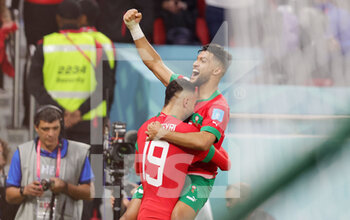 2022-12-10 - Youssef En-Nesyri of Morocco celebrates his goal 1-0 with Yahia Attiyat Allah during the FIFA World Cup 2022, Quarter-final football match between Morocco and Portugal on December 10, 2022 at Al Thumama Stadium in Doha, Qatar - FOOTBALL - WORLD CUP 2022 - 1/4 - MOROCCO V PORTUGAL - FIFA WORLD CUP - SOCCER