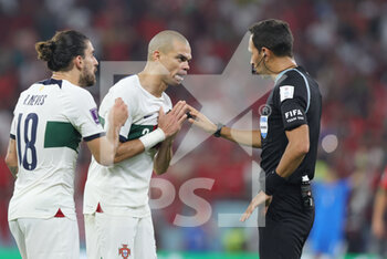 2022-12-10 - Ruben Neves, Pepe of Portugal argue with referee at half time during the FIFA World Cup 2022, Quarter-final football match between Morocco and Portugal on December 10, 2022 at Al Thumama Stadium in Doha, Qatar - FOOTBALL - WORLD CUP 2022 - 1/4 - MOROCCO V PORTUGAL - FIFA WORLD CUP - SOCCER