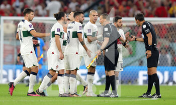 2022-12-10 - Players of Portugal argue with referee at half time during the FIFA World Cup 2022, Quarter-final football match between Morocco and Portugal on December 10, 2022 at Al Thumama Stadium in Doha, Qatar - FOOTBALL - WORLD CUP 2022 - 1/4 - MOROCCO V PORTUGAL - FIFA WORLD CUP - SOCCER