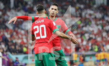 2022-12-10 - Achraf Dari and Badr Benoun of Morocco during the FIFA World Cup 2022, Quarter-final football match between Morocco and Portugal on December 10, 2022 at Al Thumama Stadium in Doha, Qatar - FOOTBALL - WORLD CUP 2022 - 1/4 - MOROCCO V PORTUGAL - FIFA WORLD CUP - SOCCER