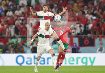 2022-12-10 - Ruben Dias, Pepe of Portugal and Youssef En-Nesyri of Morocco during the FIFA World Cup 2022, Quarter-final football match between Morocco and Portugal on December 10, 2022 at Al Thumama Stadium in Doha, Qatar - FOOTBALL - WORLD CUP 2022 - 1/4 - MOROCCO V PORTUGAL - FIFA WORLD CUP - SOCCER