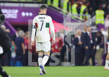 2022-12-10 - Cristiano Ronaldo of Portugal dejected at full time during the FIFA World Cup 2022, Quarter-final football match between Morocco and Portugal on December 10, 2022 at Al Thumama Stadium in Doha, Qatar - FOOTBALL - WORLD CUP 2022 - 1/4 - MOROCCO V PORTUGAL - FIFA WORLD CUP - SOCCER