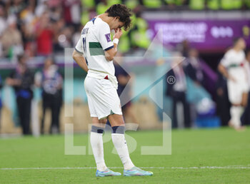2022-12-10 - Joao Felix of Portugal dejected at full time during the FIFA World Cup 2022, Quarter-final football match between Morocco and Portugal on December 10, 2022 at Al Thumama Stadium in Doha, Qatar - FOOTBALL - WORLD CUP 2022 - 1/4 - MOROCCO V PORTUGAL - FIFA WORLD CUP - SOCCER