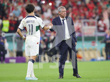 2022-12-10 - Joao Felix and Head coach Fernando Santos of Portugal dejected at full time during the FIFA World Cup 2022, Quarter-final football match between Morocco and Portugal on December 10, 2022 at Al Thumama Stadium in Doha, Qatar - FOOTBALL - WORLD CUP 2022 - 1/4 - MOROCCO V PORTUGAL - FIFA WORLD CUP - SOCCER