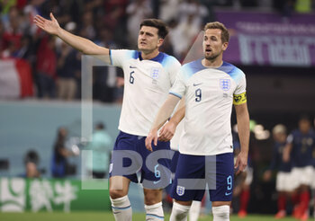 2022-12-10 - Harry Kane, Harry Maguire (left) of England during the FIFA World Cup 2022, Quarter-final football match between England and France on December 10, 2022 at Al Bayt Stadium in Al Khor, Qatar - FOOTBALL - WORLD CUP 2022 - 1/4 - ENGLAND V FRANCE - FIFA WORLD CUP - SOCCER