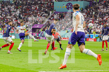 2022-12-10 - Jude Bellingham (22) of England shoots towards the goal during the FIFA World Cup 2022, Quarter-final football match between England and France on December 10, 2022 at Al Bayt Stadium in Al Khor, Qatar - FOOTBALL - WORLD CUP 2022 - 1/4 - ENGLAND V FRANCE - FIFA WORLD CUP - SOCCER