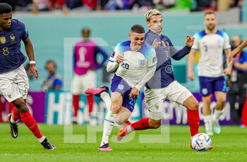 2022-12-10 - Antoine Griezmann (7) of France brings down Phil Foden (20) of England during the FIFA World Cup 2022, Quarter-final football match between England and France on December 10, 2022 at Al Bayt Stadium in Al Khor, Qatar - FOOTBALL - WORLD CUP 2022 - 1/4 - ENGLAND V FRANCE - FIFA WORLD CUP - SOCCER