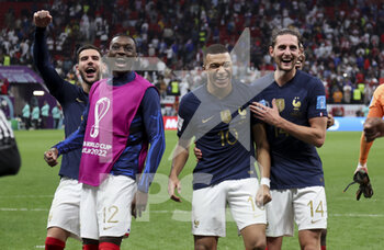 2022-12-10 - Theo Hernandez, Randal Kolo Muani, Kylian Mbappe, Adrien Rabiot of France celebrate the victory following the FIFA World Cup 2022, Quarter-final football match between England and France on December 10, 2022 at Al Bayt Stadium in Al Khor, Qatar - FOOTBALL - WORLD CUP 2022 - 1/4 - ENGLAND V FRANCE - FIFA WORLD CUP - SOCCER