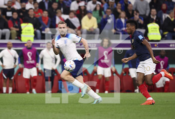 2022-12-10 - Luke Shaw of England, Kingsley Coman of France during the FIFA World Cup 2022, Quarter-final football match between England and France on December 10, 2022 at Al Bayt Stadium in Al Khor, Qatar - FOOTBALL - WORLD CUP 2022 - 1/4 - ENGLAND V FRANCE - FIFA WORLD CUP - SOCCER