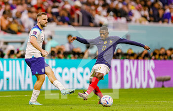 2022-12-11 - Luke Shaw (3) of England, Ousmane Dembele (11) of France during the FIFA World Cup 2022, Quarter-final football match between England and France on December 10, 2022 at Al Bayt Stadium in Al Khor, Qatar - FOOTBALL - WORLD CUP 2022 - 1/4 - ENGLAND V FRANCE - FIFA WORLD CUP - SOCCER