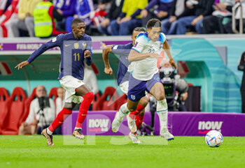 2022-12-11 - Jude Bellingham (22) of England and Ousmane Dembele, Jules Kounde of France during the FIFA World Cup 2022, Quarter-final football match between England and France on December 10, 2022 at Al Bayt Stadium in Al Khor, Qatar - FOOTBALL - WORLD CUP 2022 - 1/4 - ENGLAND V FRANCE - FIFA WORLD CUP - SOCCER