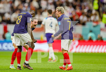 2022-12-11 - Dayot Upamecano, Adrien Rabiot, Antoine Griezmann of France celebrate at full time during the FIFA World Cup 2022, Quarter-final football match between England and France on December 10, 2022 at Al Bayt Stadium in Al Khor, Qatar - FOOTBALL - WORLD CUP 2022 - 1/4 - ENGLAND V FRANCE - FIFA WORLD CUP - SOCCER