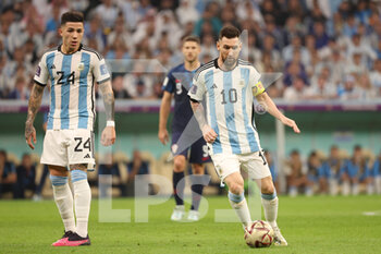 2022-12-13 - Lionel Messi of Argentina, Enzo Fernandez of Argentina (L) during the FIFA World Cup 2022, Semi-final football match between Argentina and Croatia on December 13, 2022 at Lusail Stadium in Al Daayen, Qatar - FOOTBALL - WORLD CUP 2022 - 1/2 - ARGENTINA V CROATIA - FIFA WORLD CUP - SOCCER