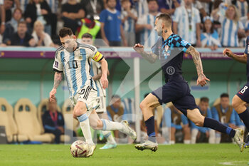 2022-12-13 - Lionel Messi of Argentina, Marcelo Brozovic of Croatia during the FIFA World Cup 2022, Semi-final football match between Argentina and Croatia on December 13, 2022 at Lusail Stadium in Al Daayen, Qatar - FOOTBALL - WORLD CUP 2022 - 1/2 - ARGENTINA V CROATIA - FIFA WORLD CUP - SOCCER