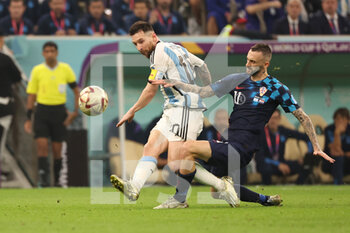 2022-12-13 - Lionel Messi of Argentina, Marcelo Brozovic of Croatia during the FIFA World Cup 2022, Semi-final football match between Argentina and Croatia on December 13, 2022 at Lusail Stadium in Al Daayen, Qatar - FOOTBALL - WORLD CUP 2022 - 1/2 - ARGENTINA V CROATIA - FIFA WORLD CUP - SOCCER