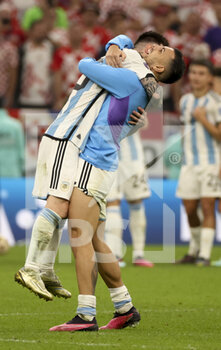 2022-12-13 - Lionel Messi, Leandro Paredes of Argentina celebrate the victory following the FIFA World Cup 2022, Semi-final football match between Argentina and Croatia on December 13, 2022 at Lusail Stadium in Al Daayen, Qatar - FOOTBALL - WORLD CUP 2022 - 1/2 - ARGENTINA V CROATIA - FIFA WORLD CUP - SOCCER