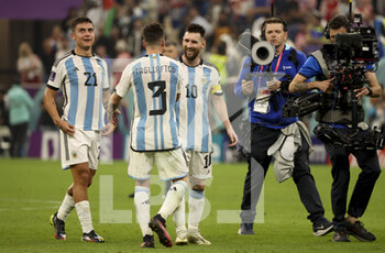 2022-12-13 - Lionel Messi (right), left Paulo Dybala, Nicolas Tagliafico celebrate the victory following the FIFA World Cup 2022, Semi-final football match between Argentina and Croatia on December 13, 2022 at Lusail Stadium in Al Daayen, Qatar - FOOTBALL - WORLD CUP 2022 - 1/2 - ARGENTINA V CROATIA - FIFA WORLD CUP - SOCCER