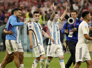 2022-12-13 - Lionel Messi of Argentina, left Nicolas Tagliafico, Leandro Paredes celebrate the victory following the FIFA World Cup 2022, Semi-final football match between Argentina and Croatia on December 13, 2022 at Lusail Stadium in Al Daayen, Qatar - FOOTBALL - WORLD CUP 2022 - 1/2 - ARGENTINA V CROATIA - FIFA WORLD CUP - SOCCER