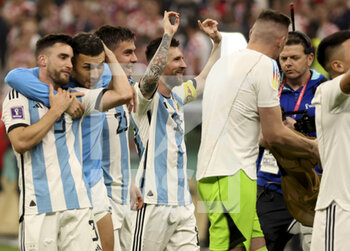 2022-12-13 - Lionel Messi of Argentina and teammates celebrate the victory following the FIFA World Cup 2022, Semi-final football match between Argentina and Croatia on December 13, 2022 at Lusail Stadium in Al Daayen, Qatar - FOOTBALL - WORLD CUP 2022 - 1/2 - ARGENTINA V CROATIA - FIFA WORLD CUP - SOCCER
