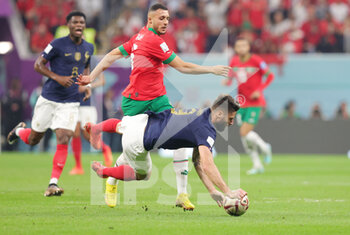 2022-12-14 - Olivier Giroud of France and Selim Amallah of Morocco during the FIFA World Cup 2022, Semi-final football match between France and Morocco on December 14, 2022 at Al Bayt Stadium in Al Khor, Qatar - FOOTBALL - WORLD CUP 2022 - 1/2 - FRANCE V MOROCCO - FIFA WORLD CUP - SOCCER