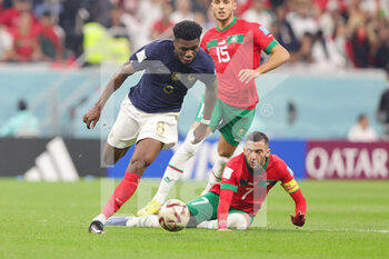 2022-12-14 - Aurelien Tchouameni of France and Hakim Ziyech of Morocco during the FIFA World Cup 2022, Semi-final football match between France and Morocco on December 14, 2022 at Al Bayt Stadium in Al Khor, Qatar - FOOTBALL - WORLD CUP 2022 - 1/2 - FRANCE V MOROCCO - FIFA WORLD CUP - SOCCER