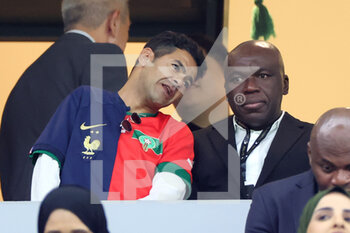 2022-12-14 - Jamel Debbouze and Wilfried Mbappe, father of Kylian Mbappe of France attend the FIFA World Cup 2022, Semi-final football match between France and Morocco on December 14, 2022 at Al Bayt Stadium in Al Khor, Qatar - FOOTBALL - WORLD CUP 2022 - 1/2 - FRANCE V MOROCCO - FIFA WORLD CUP - SOCCER