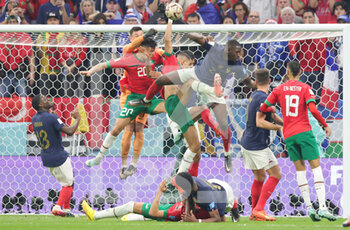 2022-12-14 - Hugo Lloris and Ibrahima Konate of France battle with Achraf Dari of Morocco during the FIFA World Cup 2022, Semi-final football match between France and Morocco on December 14, 2022 at Al Bayt Stadium in Al Khor, Qatar - FOOTBALL - WORLD CUP 2022 - 1/2 - FRANCE V MOROCCO - FIFA WORLD CUP - SOCCER