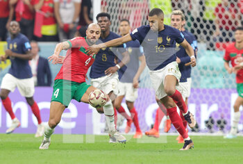 2022-12-14 - Sofyan Amrabat of Morocco and Kylian Mbappe of France during the FIFA World Cup 2022, Semi-final football match between France and Morocco on December 14, 2022 at Al Bayt Stadium in Al Khor, Qatar - FOOTBALL - WORLD CUP 2022 - 1/2 - FRANCE V MOROCCO - FIFA WORLD CUP - SOCCER
